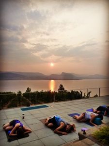 Bench1775 People doing yoga at sunset